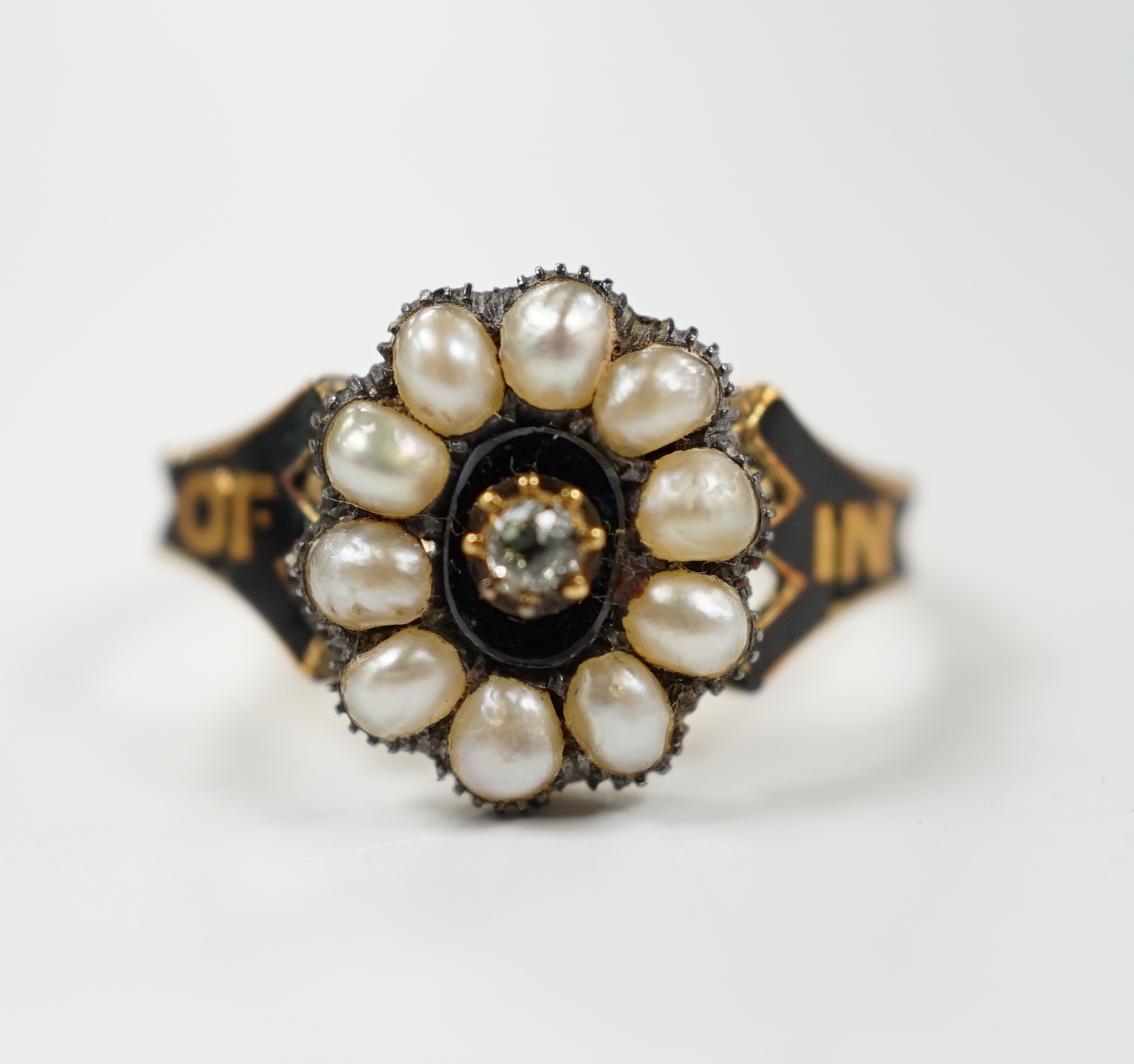 A Victorian 18ct gold, diamond, split pearl and black enamel set mourning ring, size O, gross weight 3.5 grams.